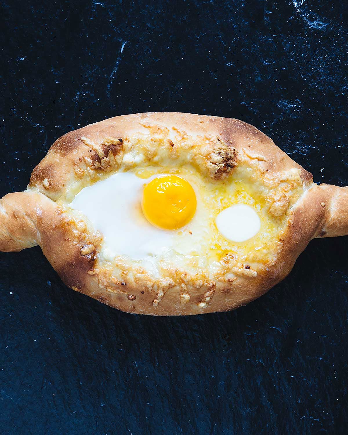 Adjaruli Khachapuri Recipe (Georgian Cheese Bread) | Saveur