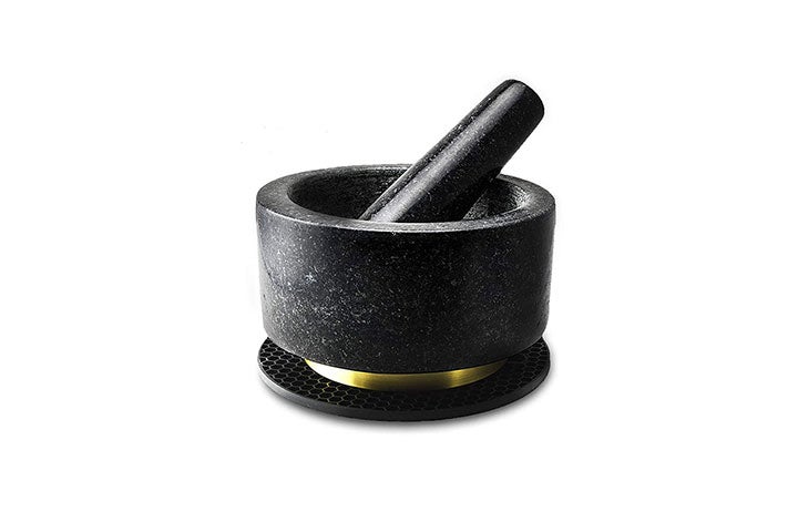 https://www.saveur.com/uploads/2019/10/12/best-mortar-and-pestles-counter-appeal-richro-black-granite-and-gold-mortar-and-pestle-saveur.jpg?auto=webp