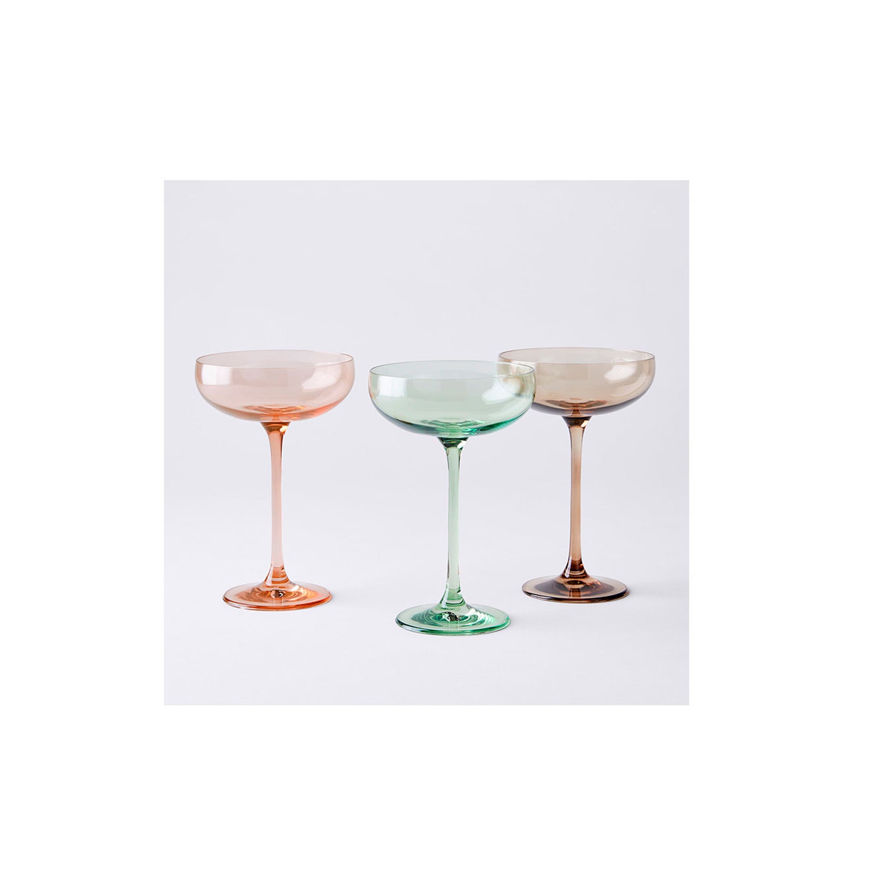 https://www.saveur.com/uploads/2021/09/17/The-Best-Martini-Glass-Option-Estelle-Colored-Glass-Handblown-Cocktail-Coupes.jpg?auto=webp