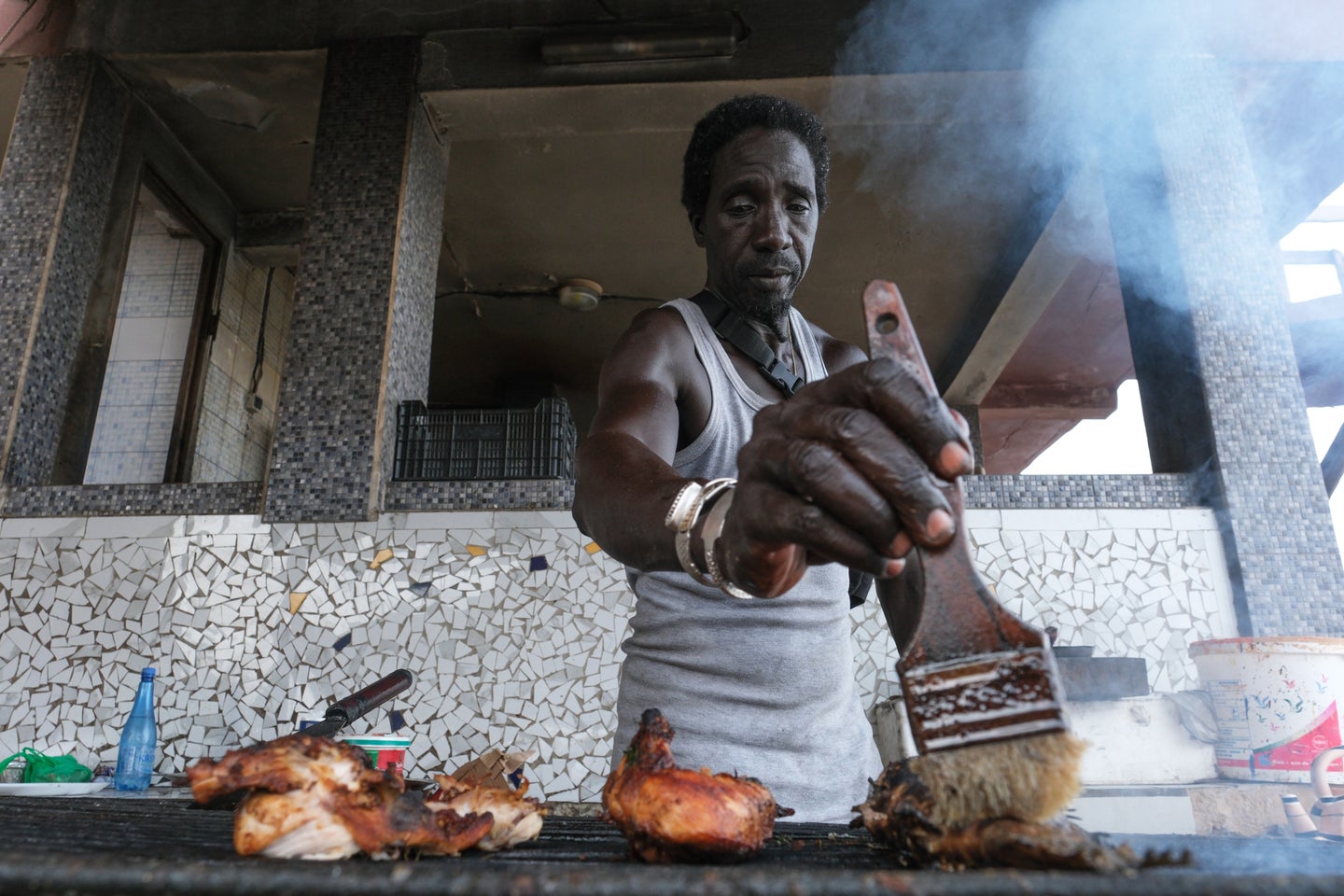 Grilling fish at Chez Seck in Dakar, Senegal