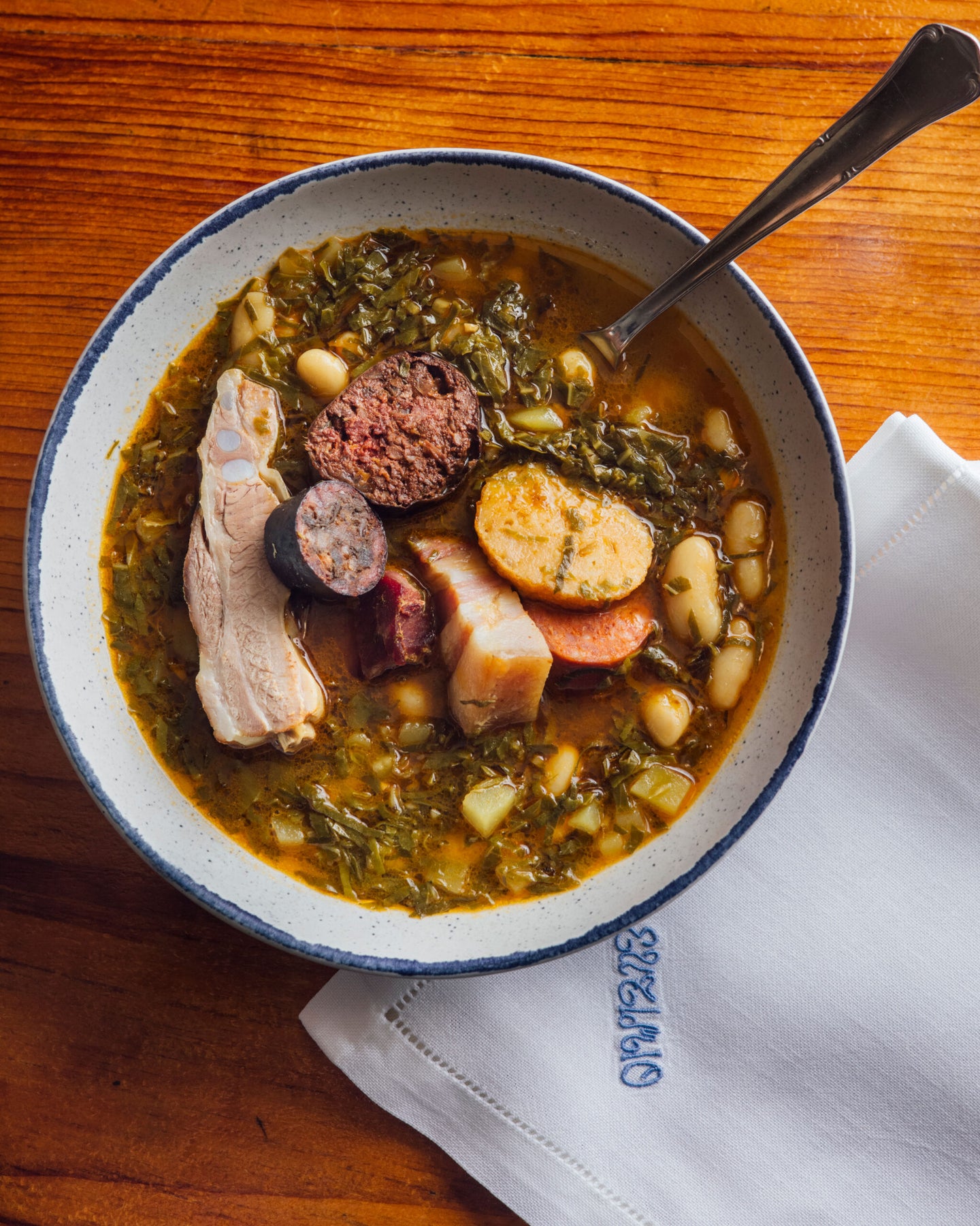 Pote de Berzas con Pantrucu (Pork Stew with Greens and Cornmeal Dumplings)